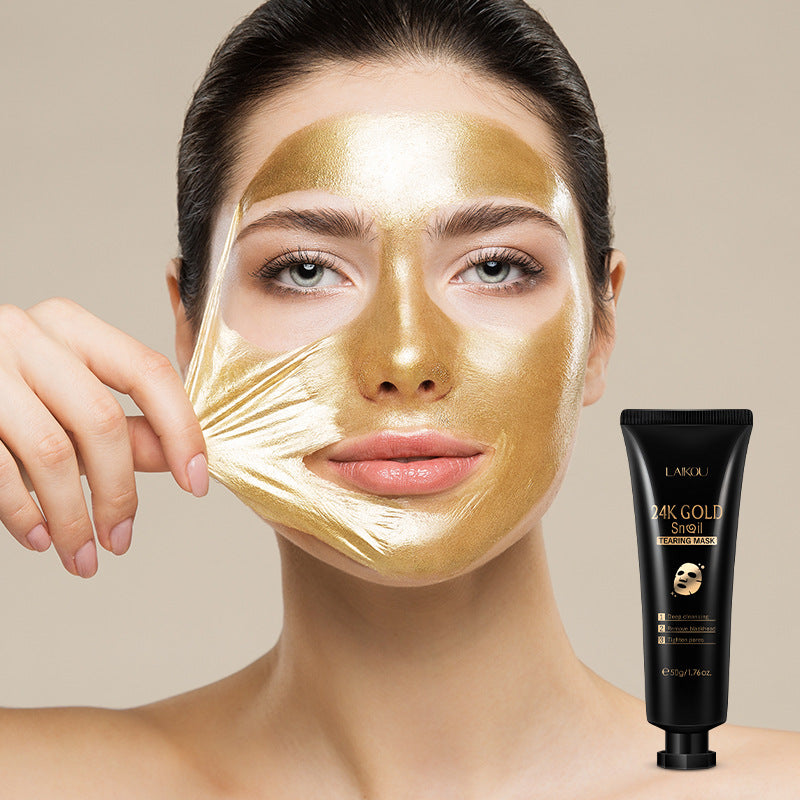 Woman peeling off a gold hydrogel organic and functional face mask from her face next to black skincare tube