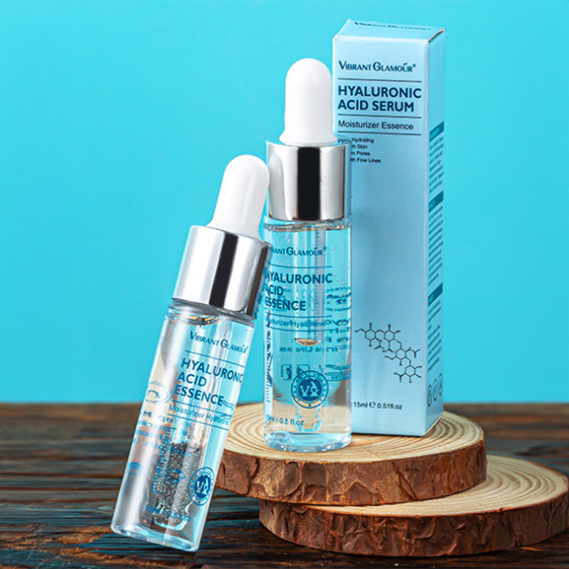 Hyaluronic acid serum bottles and box displayed on wooden slices for organic and functional face mask skincare